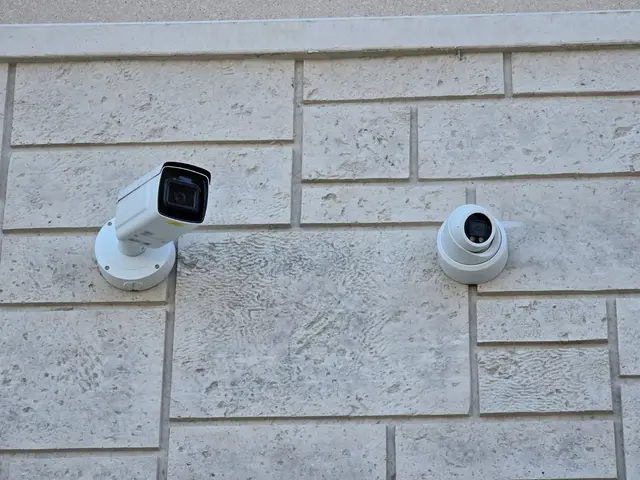 Bullet camera and turret camera on the stone wall of a new plaza