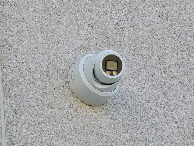 Close-up of a turret camera on a concrete wall