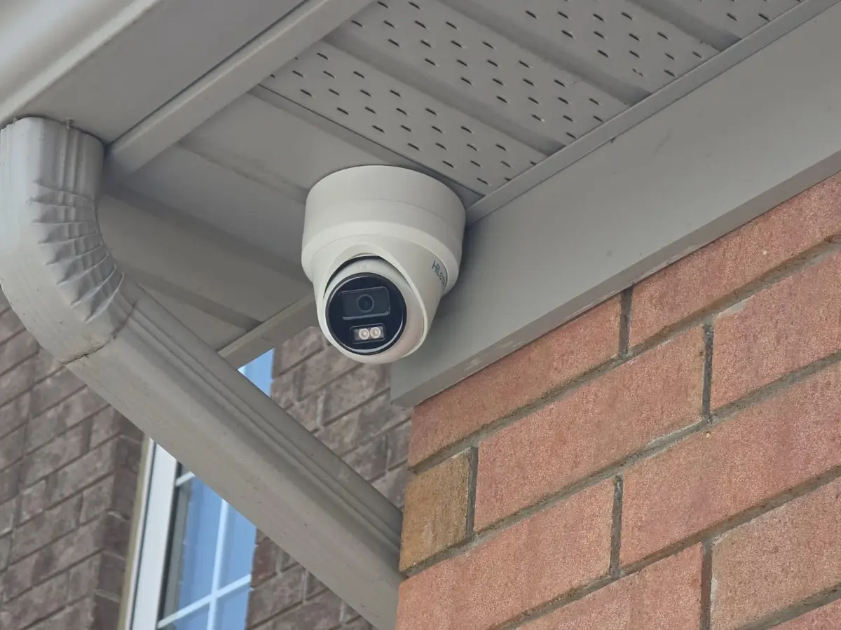 Colour night vision turret camera in a soffit corner next to the downspout